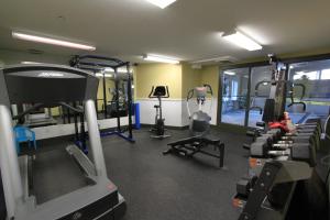 a gym with a bunch of tread machines in it at Silver Rock Condominiums by Fernie Central Reservations in Fernie