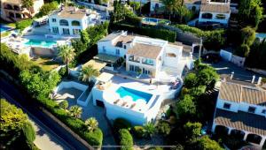 an aerial view of a house with a swimming pool at Casa El Sueño in Jávea