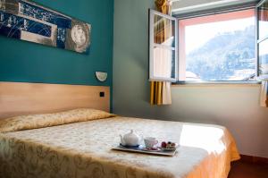 Ένα ή περισσότερα κρεβάτια σε δωμάτιο στο Lizard Hotel