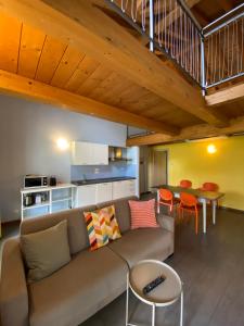 a living room with a couch and a table at Marenca Residence in Cannobio