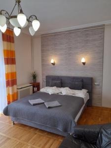 Posteľ alebo postele v izbe v ubytovaní Zöld Sziget Apartmanlakás