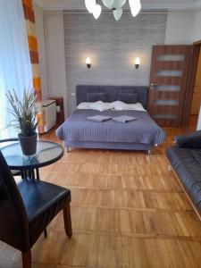 Posteľ alebo postele v izbe v ubytovaní Zöld Sziget Apartmanlakás