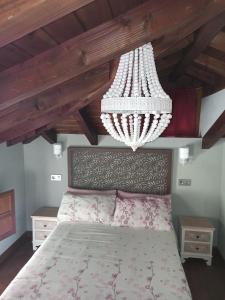 Postel nebo postele na pokoji v ubytování Aromas de Coraín