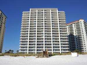 a large building on the beach next to the sand at The Pearl Of Navarre 705 in Navarre