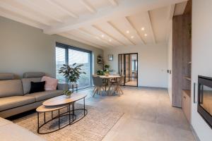 Posezení v ubytování Vakantiewoning De Bles