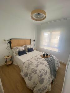 Postel nebo postele na pokoji v ubytování Apartamento La Muralla