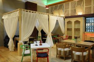 En restaurang eller annat matställe på Mira Trio Hotel - Riyadh - Tahlia Street