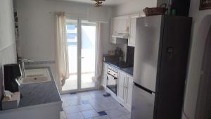 Kuchyň nebo kuchyňský kout v ubytování T4 89m2, Cap d'Agde, Secteur Falaise, Vue mer, Clim, 8 pers, WIFI, 100 m plage