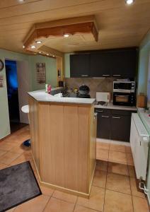 a kitchen with a sink and a counter top at Ferienwohnung Am Berg in Wieda