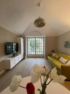 a living room with a couch and a table at Pergolato junior in Sanremo