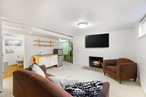 a living room with a couch and a fireplace at Hillside on North Queen Anne in Seattle