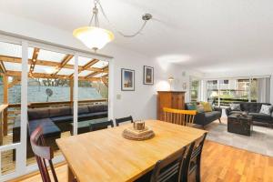 a dining room and living room with a table and chairs at Hillside on North Queen Anne in Seattle