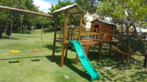 a playground in a park with a slide at Paraíso das Águas in Camacari