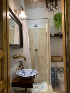 a bathroom with a sink and a shower at Le Tre Terrazze in Bologna +35 photos