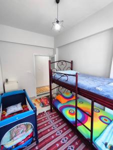 a room with two bunk beds and a hallway at The Life House Alanya in Alanya