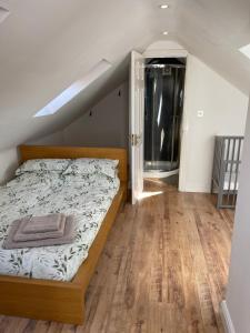 a bedroom with a bed and a stair case at Spacious 10 bed house in Leicester in Leicester