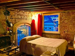 A bed or beds in a room at Torre Ducale Dimora Storica