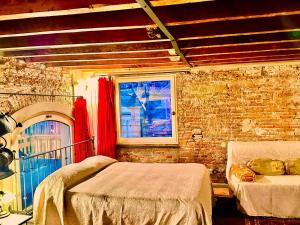 A bed or beds in a room at Torre Ducale Dimora Storica