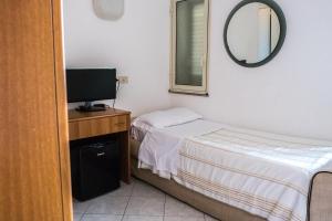 Cama ou camas em um quarto em Hotel Villino Gallodoro