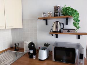 Kaffe- og tefaciliteter på Appartamento IN CENTRO Free Wi-Fi, Self check-in