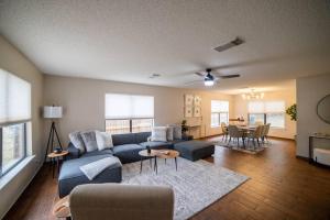 a living room with a blue couch and a table at Perfect stay in San Antonio TX in San Antonio