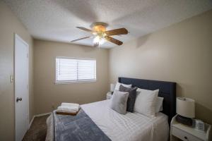 a bedroom with a bed with a ceiling fan at Perfect stay in San Antonio TX in San Antonio