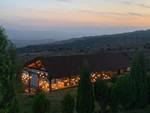 a building with a lot of lights on it at Amberd Hotel in Byurakan