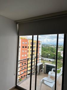 a balcony with a view of a building at Fresco, cómodo y Amplio! in Neiva