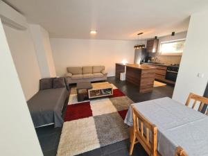 a living room with a bed and a couch at Villa Ska in Pula
