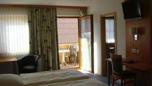 Postel nebo postele na pokoji v ubytování Hotel garni Hopfengold