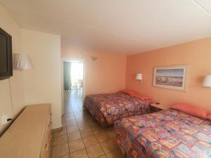 Postel nebo postele na pokoji v ubytování Caprice Motel - Wildwood