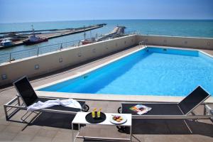 a swimming pool on the roof of a cruise ship at Hotel Tiber in Fiumicino