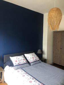 Posteľ alebo postele v izbe v ubytovaní L'Aiguillon, bel appartement hyper-centre