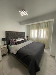 a bedroom with a large bed and a window at IGiDELUX in Era de Soler