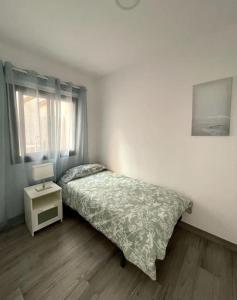 Łóżko lub łóżka w pokoju w obiekcie Moderno apartamento frente al mar