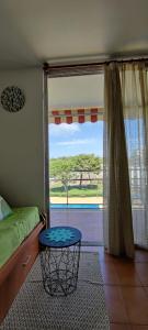 a bedroom with a bed and a window with a view at Reus y MAr Salou in Salou