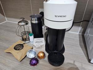 a krispy kreme mixer sitting on a counter with decorations at 1 bed modern flat in Didcot