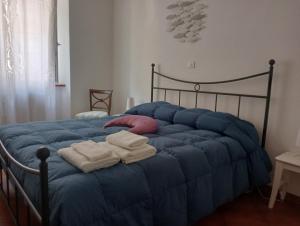 Posteľ alebo postele v izbe v ubytovaní Casa Azzurra