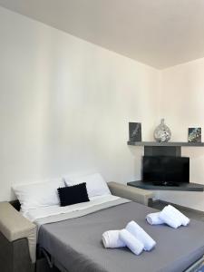Giường trong phòng chung tại 502 Porto Cervo Apartment +20 ảnh