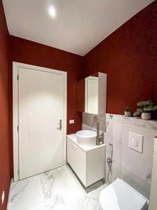 a bathroom with a toilet and a sink at Phi Apartments 1 min from the beach - New Additions in Durrës