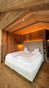 Un ou plusieurs lits dans un hébergement de l'établissement Amus Suites Dolomites