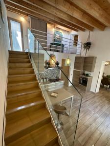 a staircase with a glass railing in a house at Balconi Bellavista in Cefalù