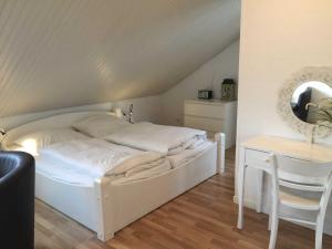Postel nebo postele na pokoji v ubytování Gaestehaus Denecke