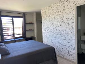 Postel nebo postele na pokoji v ubytování Meherio - Bel Appartement vue mer à TAHITI