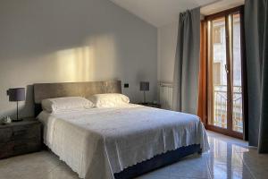 Postel nebo postele na pokoji v ubytování Luxury Home Cabras Centro