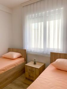 Ένα ή περισσότερα κρεβάτια σε δωμάτιο στο Rooms LikeHome