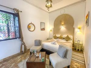 Postel nebo postele na pokoji v ubytování Riad des Lys