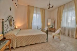 A bed or beds in a room at la Casa del Vino - B&B