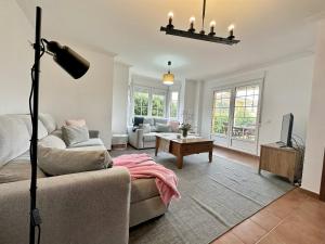a living room with a couch and a tv at Villa Ojerada - 12804 in Ajo