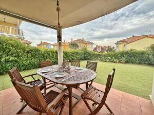 a wooden table and chairs on a patio at Villa Ojerada - 12804 in Ajo